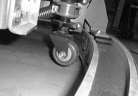 MAINTENANCE 5. To adjust the amount of deflection, loosen the caster jam nut. Turn the caster shaft using the flats. Turn the shaft clockwise to decrease the blade deflection.