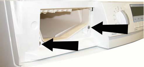 Remove the lateral (b) screws which secure the control panel to the crosspiece and release the anchor tabs (a) from the