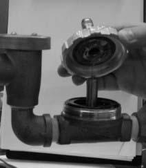 SECTION 5: SERVICE PROCEDURES RINSE SOLENOID VALVE REPAIR PARTS KIT (CONTINUED) Removing the valve bonnet 13. Slowly remove the valve bonnet.