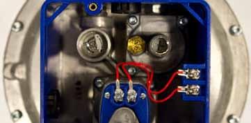 It should just reach the first set of holes on the mixing plate. 3. If the minimum fire needs to be adjusted, remove the modulating gas valve cap and adjust the bypass regulator. 4.