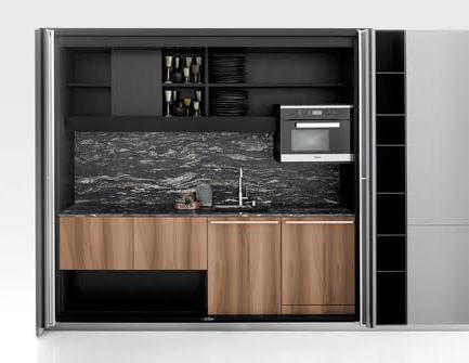 HIDE tall unit by Piero Lissoni & CRS Boffi The epitome of minimalist design, Boffi s HIDE kitchen is designed to conceal a complete, full-working kitchen including appliances, a sink and shelving
