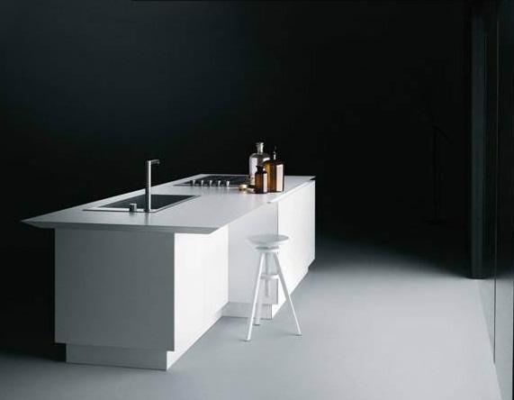 K14 island and base unit by Norbert Wangen The K14 kitchen is an elegant and seamless statement piece characterized by its top beveled edges and finish that wraps around the doors to the side panels,