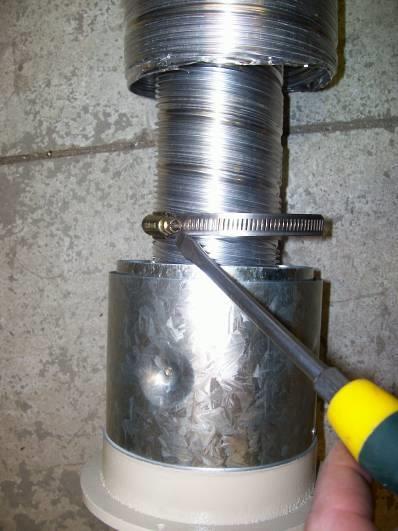 Fit hose clamp over 75mm flue. Fit 75mm flue over spigot.