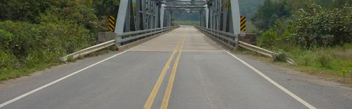 The bridge is a two span, through Pennsylvania steel truss bridge.