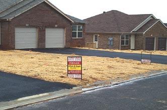 Excellent application of hand-scattered straw mulch in new residential subdivision.