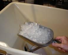 Remove and discard all the ice from the hopper using an ice scoop.