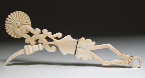 CARVED WHALE IVORY PIE CRIMPER, circa 1860, the grip with an open diamond and