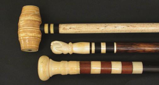 166. WHALE IVORY AND WOOD WALKING STICK, circa 1860, large turned ivory knob with abalone disk mounted on six sections of tropical wood and ivory on a tapering ebony shaft.