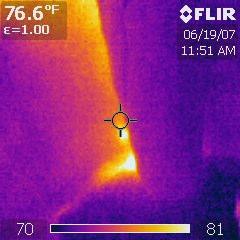 The elongated fingers of different temperature are typical of what is seen with air infiltration as seen with a thermal imager. Ridge beam rock fireplace intersection on the north side.