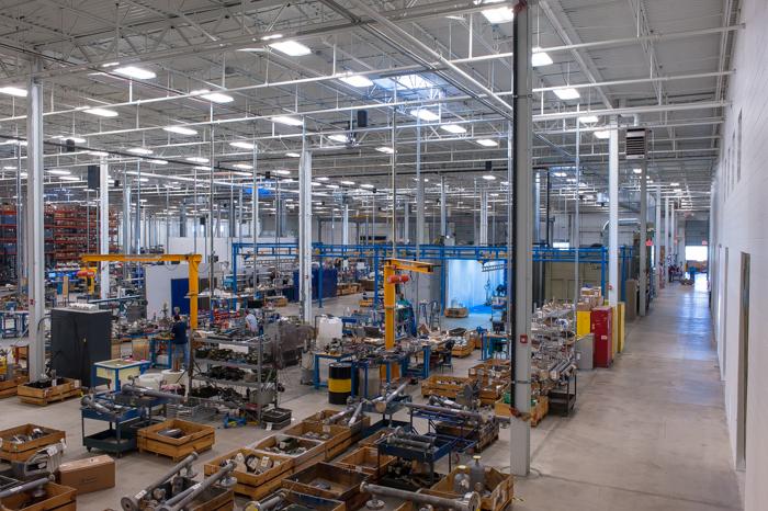 A180.11 Fabrication Facility: The renovated warehouse area is repurposed as the Production Floor.