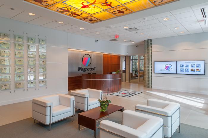 A180.05 Lobby/Waiting Area: The existing lobby space was refinished and provides electronic information monitors and features a wall displaying a small fraction of the company s