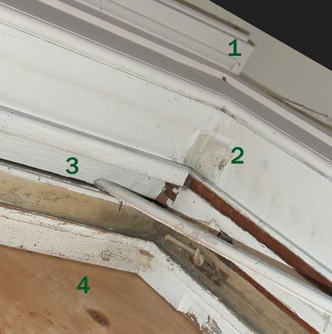 This photograph is of the top of the window frames in the room shown above. No. 1 is the top of the inside of the window frame. No. 2 is the jamb of the window frame. No. 4 is the plywood installed on the outside of the window to protect the house while the glass is removed for restoration.