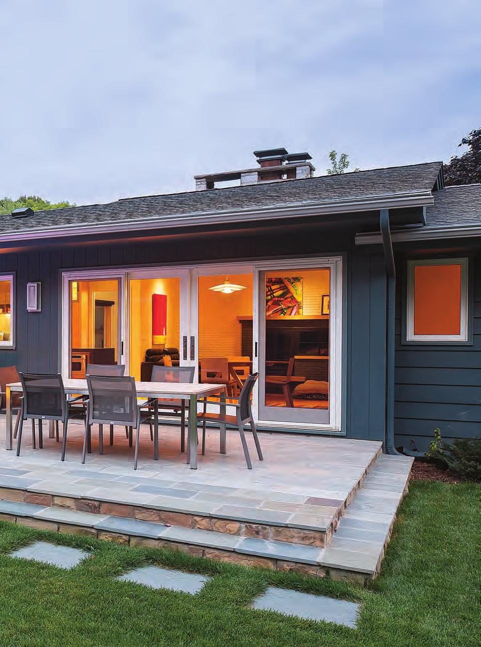 Backyard oasis Vertical fiber-cement siding, which complements the home s original redwood siding, helps the 2-ft. addition blend seamlessly into the rear elevation.