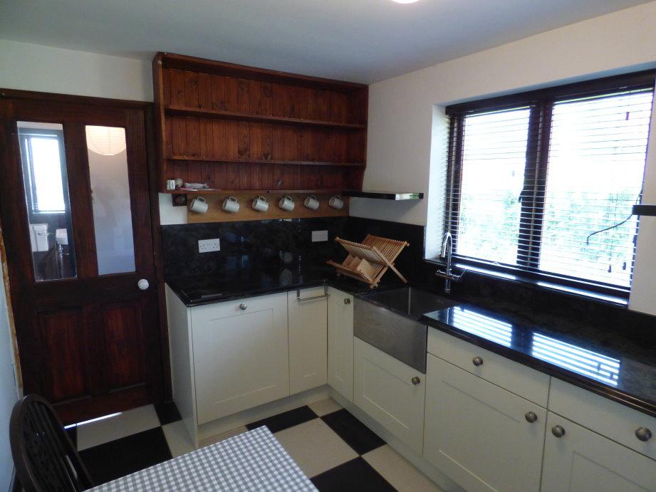 With ribbed entrance mat, open doorway into Inner Hall / Study Area and glazed internal doors into: KITCHEN DINER (12 11 max x 7 9 max) with black and white chequered ceramic tiled flooring,
