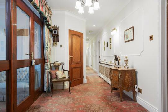 The Property Comprises: Hardwood front door with leaded glass panel and