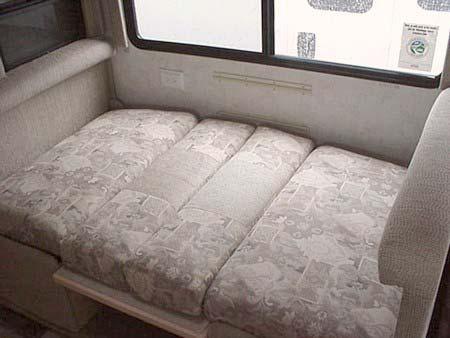 Arrange dinette cushions to cover bed area. Dinette to Bed 1.