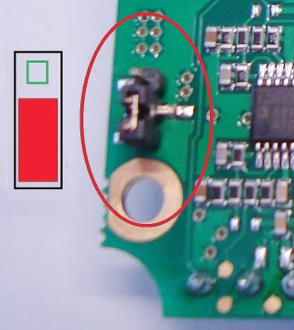 Ground Connection At the bottom side of the mainboard PCB you will find a connector (jumper) which has been placed from factory side as shown in the picture [bottom and middle pin connected].