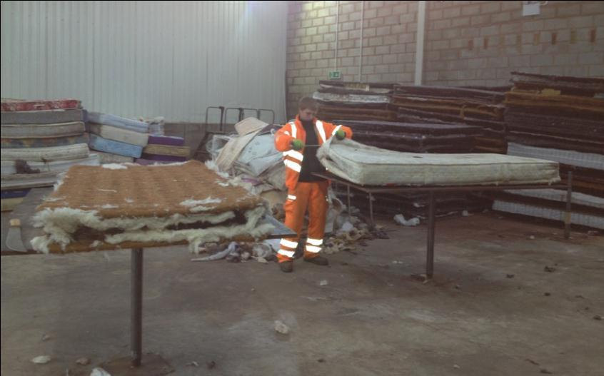 Figure 1 Mattresses being taken apart in Denbigh Innovation/good practice By deconstructing mattresses, sanitising and re-using or recycling all the different materials EOL Recycling s process makes
