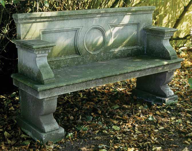 The Neo-Classical Seat A hand carved natural limestone seat having panelled back with central roundel, dentil