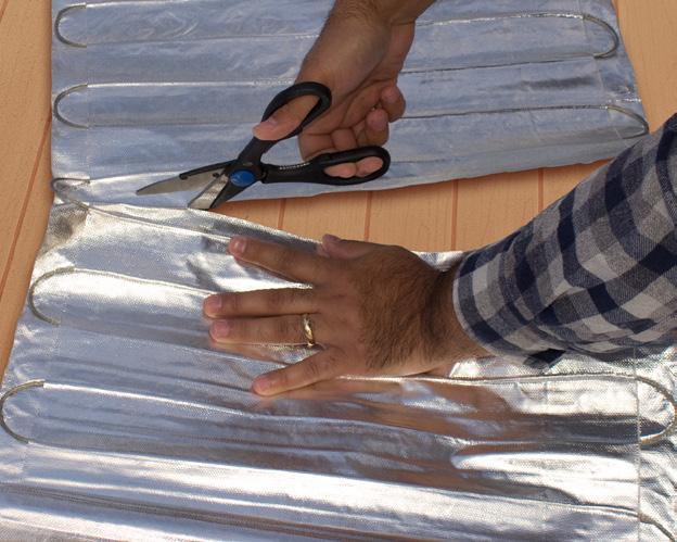 When positioning the mat on the underlayment/insulation, be aware of the following: Keep it at least 6 inches (150mm) from any edge of the Laminate and 300mm for the carpet, (to prevent the spikes of