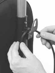 Once the cord is secured by the cord hook, proceed with wrapping the cord. Wrap the cord clockwise around the top and bottom cord hooks.