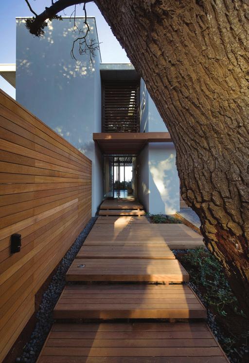 ENTRANCE A sense of arrival is created by two milkwood trees flanking the entrance.
