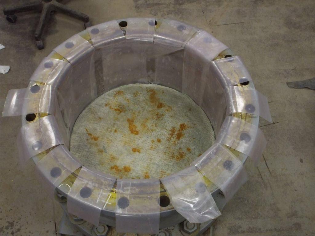 Figure 9. GLLS being assembled. A special friction treatment is used to ensure that 95% (or more) of the applied stress is transferred to the liner system (see Brachman et al. 2008 for details). 4.