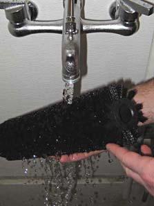 Remove and clean the brush (Figure 26).