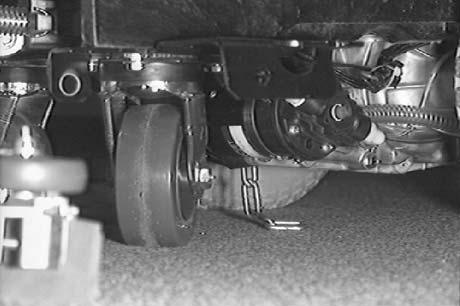 MAINTENANCE LUBRICATION REAR CASTERS The rear casters each have one grease fitting on the caster swivel. Lubricate the caster with a grease gun containing Lubriplate EMB grease (TENNANT part no.