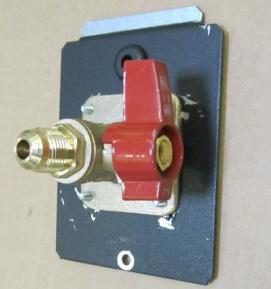 2. Remove the screw that holds the shutoff valve plate in place (1/4 nutdriver). Remove the shutoff valve plate. 3.