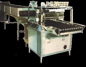 operating sequence is transparent guard. The 1. The products are placed on the infeed loading table 2. They pass via the grill belt through a double curtain of liquid chocolate.
