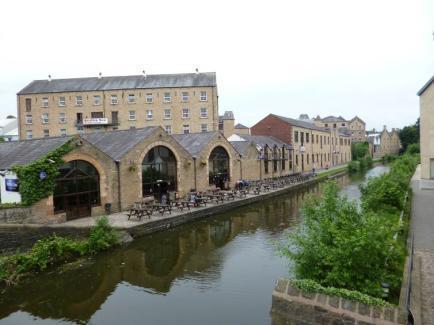 The canal and related historic structures contribute strongly to the character of the area, with stone copings to the towpath and stone retaining walls, and a variety of bridge designs.