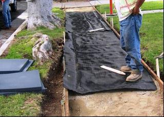 Step five: laying geotextile 13 Photos do not illustrate specified non woven permeable geotextile Geotextile is 12.5' wide.
