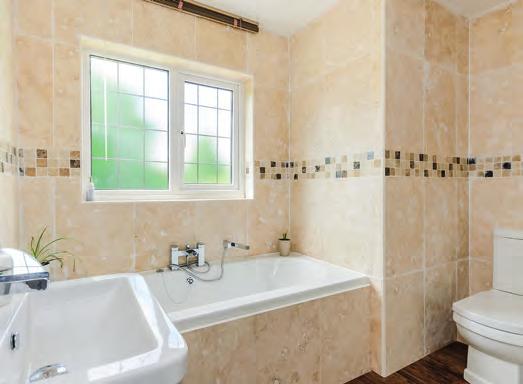 property and has an ensuite with a modern white suite.