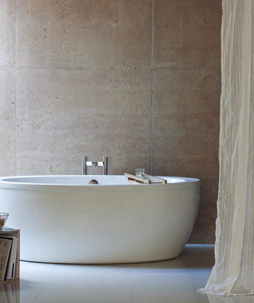 FREEFUERTE A sumptuous, oval shaped free-standing two piece bath with surround which will act as an eye-catching centre-piece to any contemporary