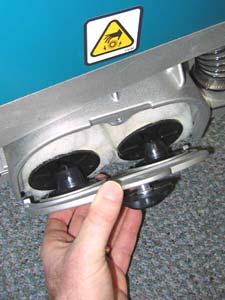 Make sure the idler plate hooks engage the scrub head and that the locking knob is secure (Figure 3).