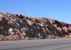 Appears like a natural rock outcrop. Blend the rock cut with the landscape when weathering techniques are used.