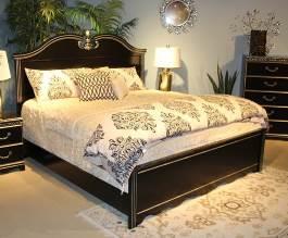 B301 Navoni Traditional design in a replicated black finish Features broken pediment style mirror and headboard design Antique silver metalized trim on edges of drawers, mirror, and bed crowns Glossy