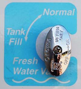 Turn the Fresh Water valve to the Tank Fill position. Fresh Water Valve (Located in water service center) Fresh Water Valve (Located in water service center) 3. Turn city water supply ON. 4.