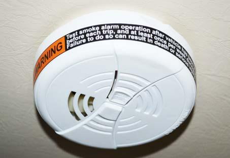 ) The Smoke Alarm is powered by a 9-volt battery and has a sensor that is designed to detect smoke.