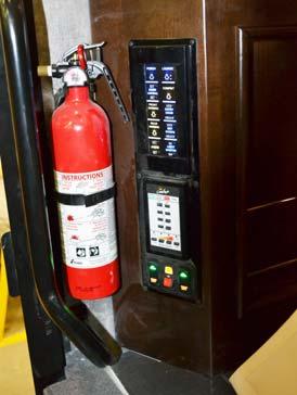 SECTION 2 SAFETY AND PRECAUTIONS FIRE EXTINGUISHER A dry chemical Fire Extinguisher is located near the entrance door.