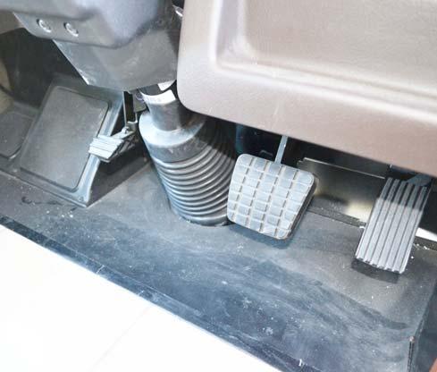 SECTION 3 DRIVING YOUR MOTORHOME STEERING COLUMN ADJUSTMENT The tilt/telescope adjustment pedal is located on the floor to the left of the steering column as shown.