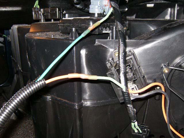 Near the blower motor in the rear of the cab (under the bunk) locate the