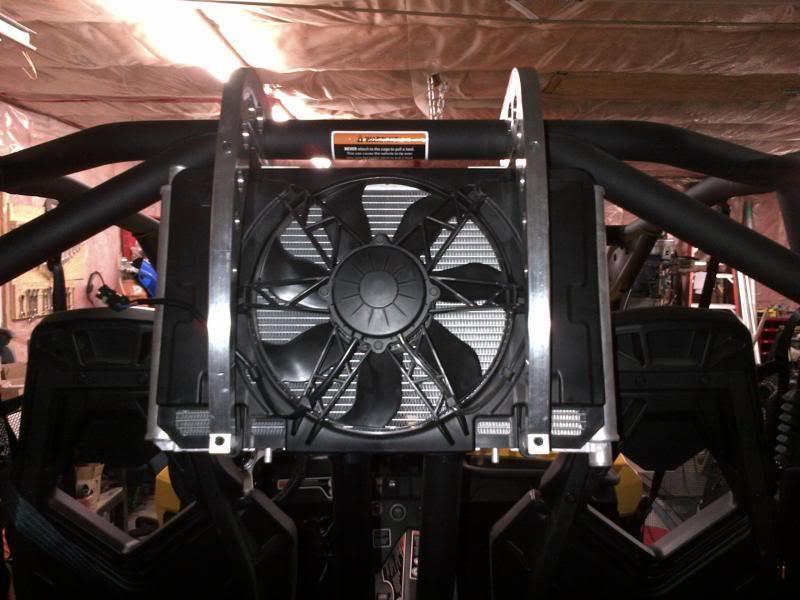 -Install the 2 larger mounting brackets to the radiator using the supplied hardware and aluminum spacers. The bolts will thread right into the factory threaded clips on the radiator.