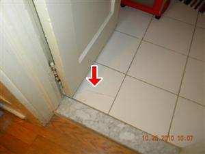 (2) Cracked tile noted on floors. 4.27.A Picture 1 4.28.A DOORS (BATHROOMS) 4.29.A WINDOWS (BATHROOMS) 4.27.A Picture 2 4.30.A COUNTERS AND A REPRESENTATIVE NUMBER OF CABINETS (BATHROOMS) 4.31.
