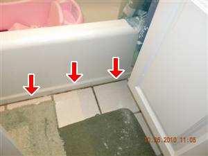 Page 30 of 70 The caulking where the floor meets the tub is cracked and loose, which can lead to moisture penetration behind floors.