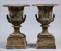 Lots 201-210 Lot #201: PAIR OF ENGLISH CAST IRON URNS, AFTER THE BORGHESE VASE, ATTRIBUTED TO THE HANDYSIDE FOUNDRY On stepped plinth bases; 25 x 15 1/2 in.