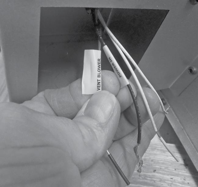 Run a 14-2 wire from the fireplace to the power vent. Connect wires to the blue and white wires in the junction box.