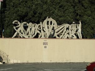 Northwest end of Casa Italiana parking lot "The Immigrants" Sculpture Year built: 1971 Sub context: Cultural Development and Institutions, 1850-1980 Theme: Public Art, 1900-1980 Sculpture, 1900-1980