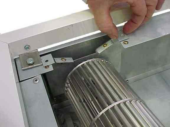 Locate and remove element fixing screws by inserting a screwdriver through the